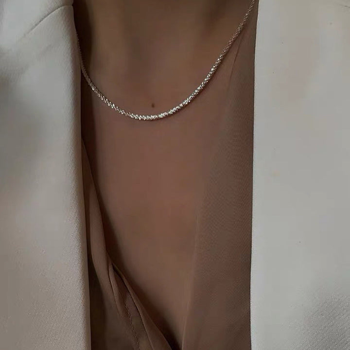 Delicate silver-tone textured chain necklace. Women's versatile dainty jewelry, ideal for everyday elegance.