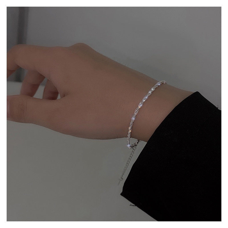 Versatile silver-tone textured chain bracelet. Delicate women's accessory for a minimalist and elegant look.