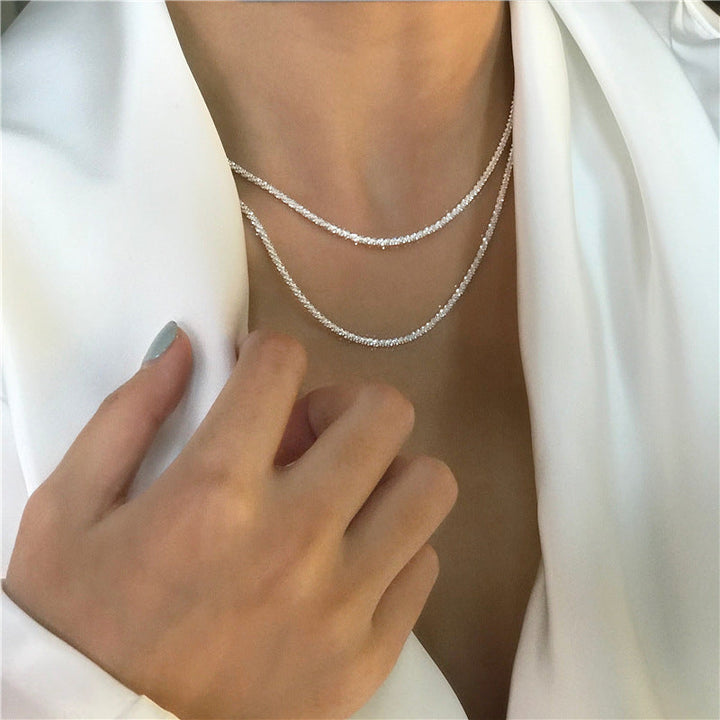 Gold-tone textured chain jewelry set. Dainty necklace & bracelet, elegant women's accessories with minimalist appeal.