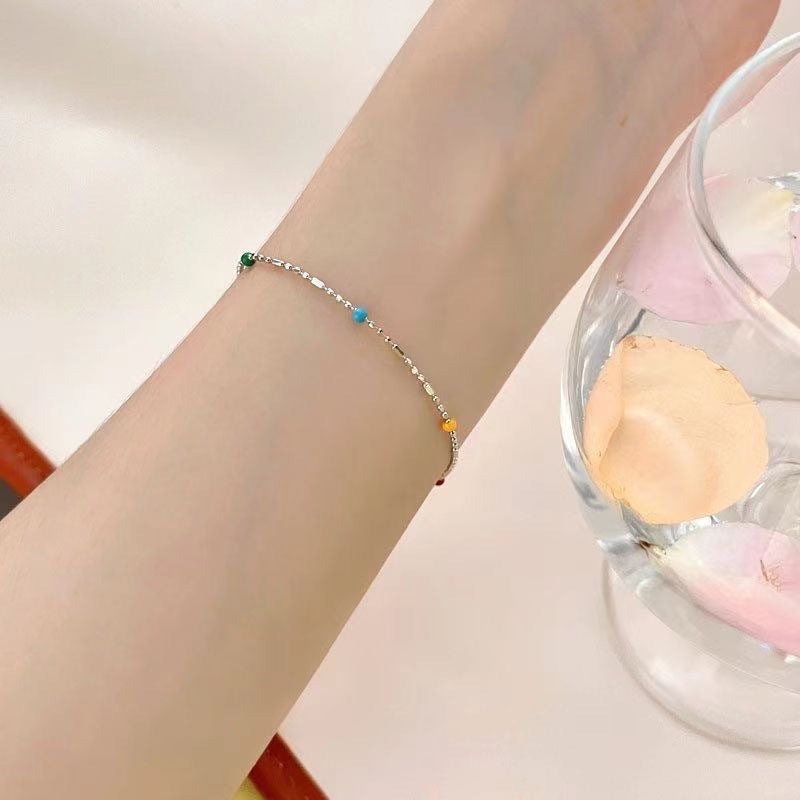 Stylish multi-color beaded chain bracelet for women, a vibrant and dainty fashion accessory to elevate any look.