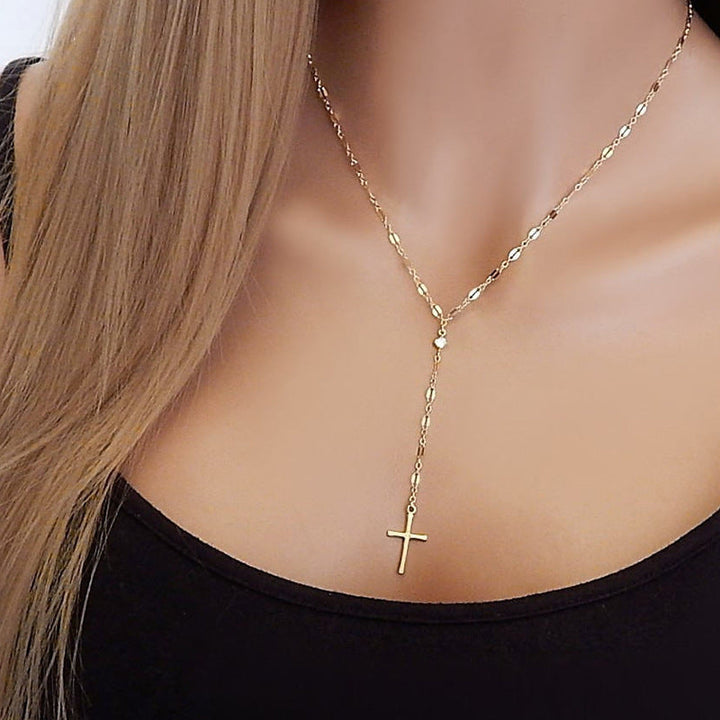 Dainty silver cross lariat necklace for women, elegant spiritual jewelry, perfect faith gift.
