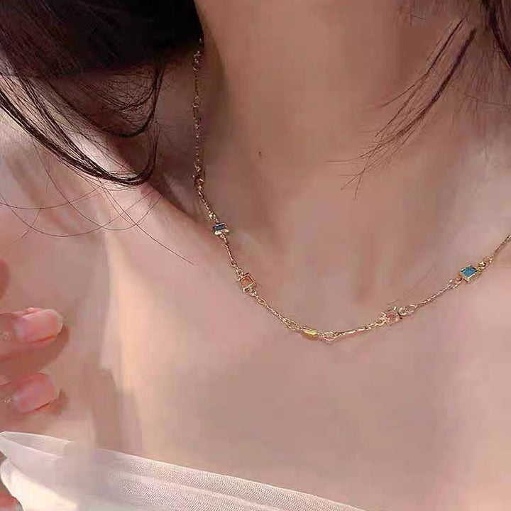Delicate white link chain necklace for women, a dainty and colorful fashion jewelry piece.