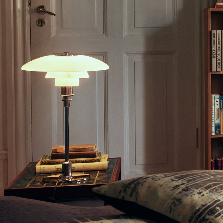 Minimalist Danish LED table lamp, crafted from iron & glass, providing warm ambient light.