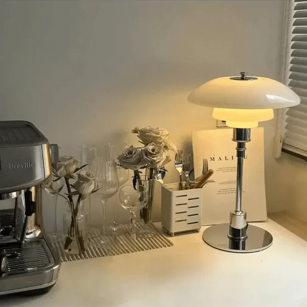 Living room Danish designer table lamp, warm LED light and modern aesthetic.