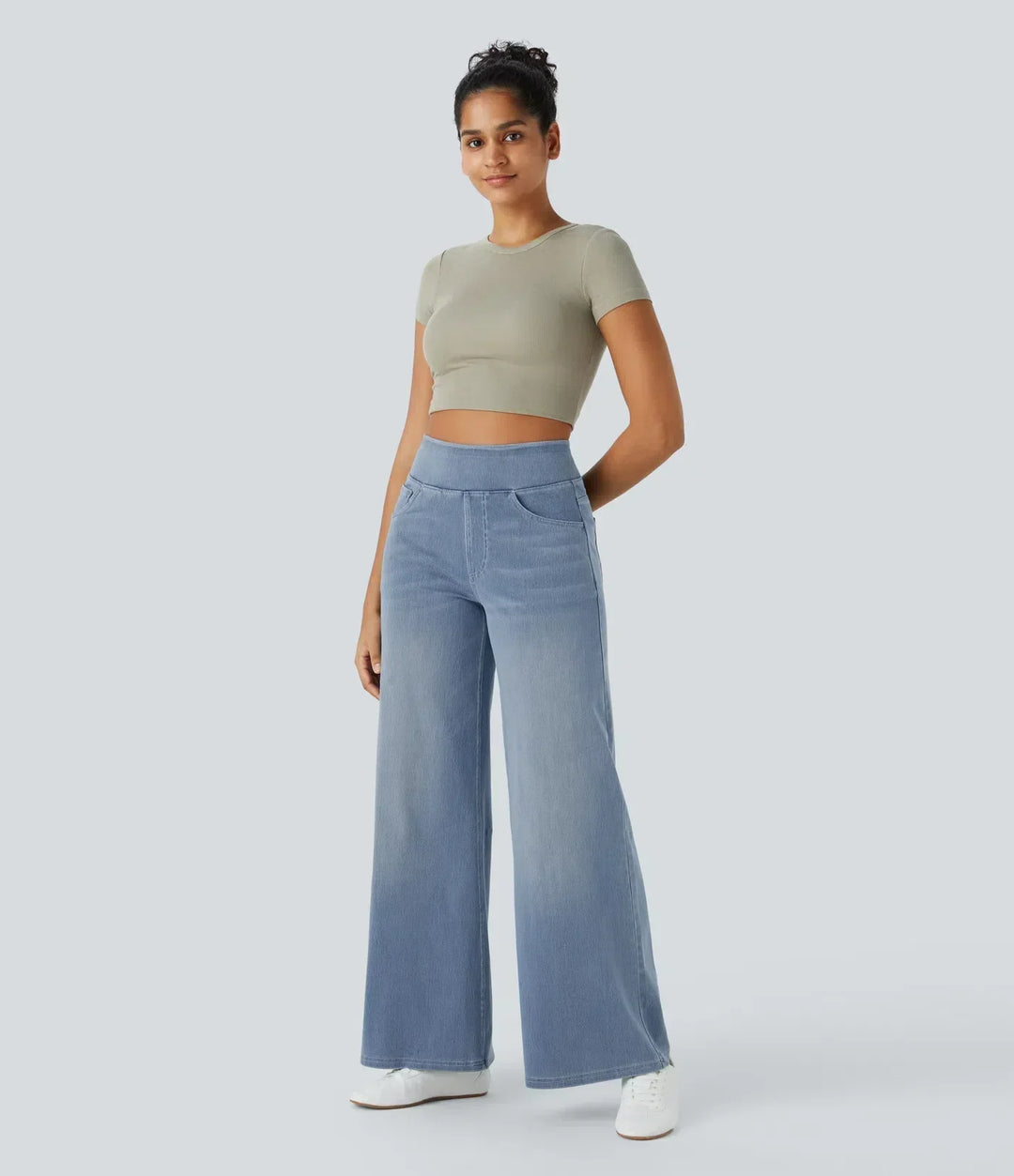 Versatile dark blue high-waisted wide-leg trousers, stretch fabric for women's everyday wear.