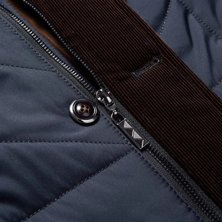 Men's stylish quilted winter jacket featuring a stand collar & button closure. Warm casual outerwear for men.