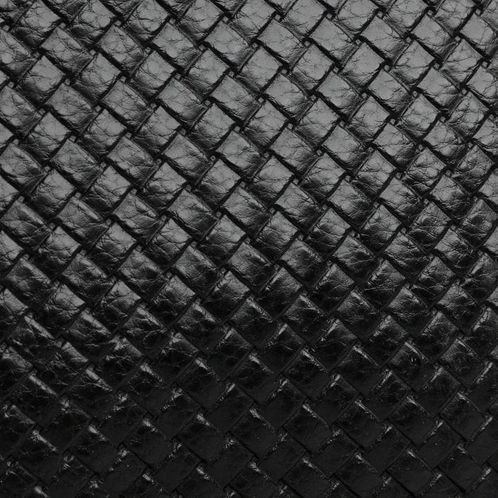 Versatile men's leather shoulder bag, shown at an angle, ideal for travel & daily use.
