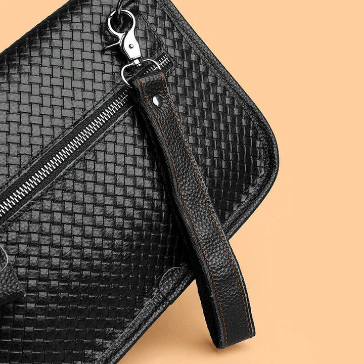 Robust metal hardware on a men's premium leather crossbody sling bag.
