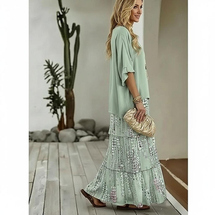 Fashionable women's matching green sequin two-piece set featuring a dazzling crop top & maxi skirt.