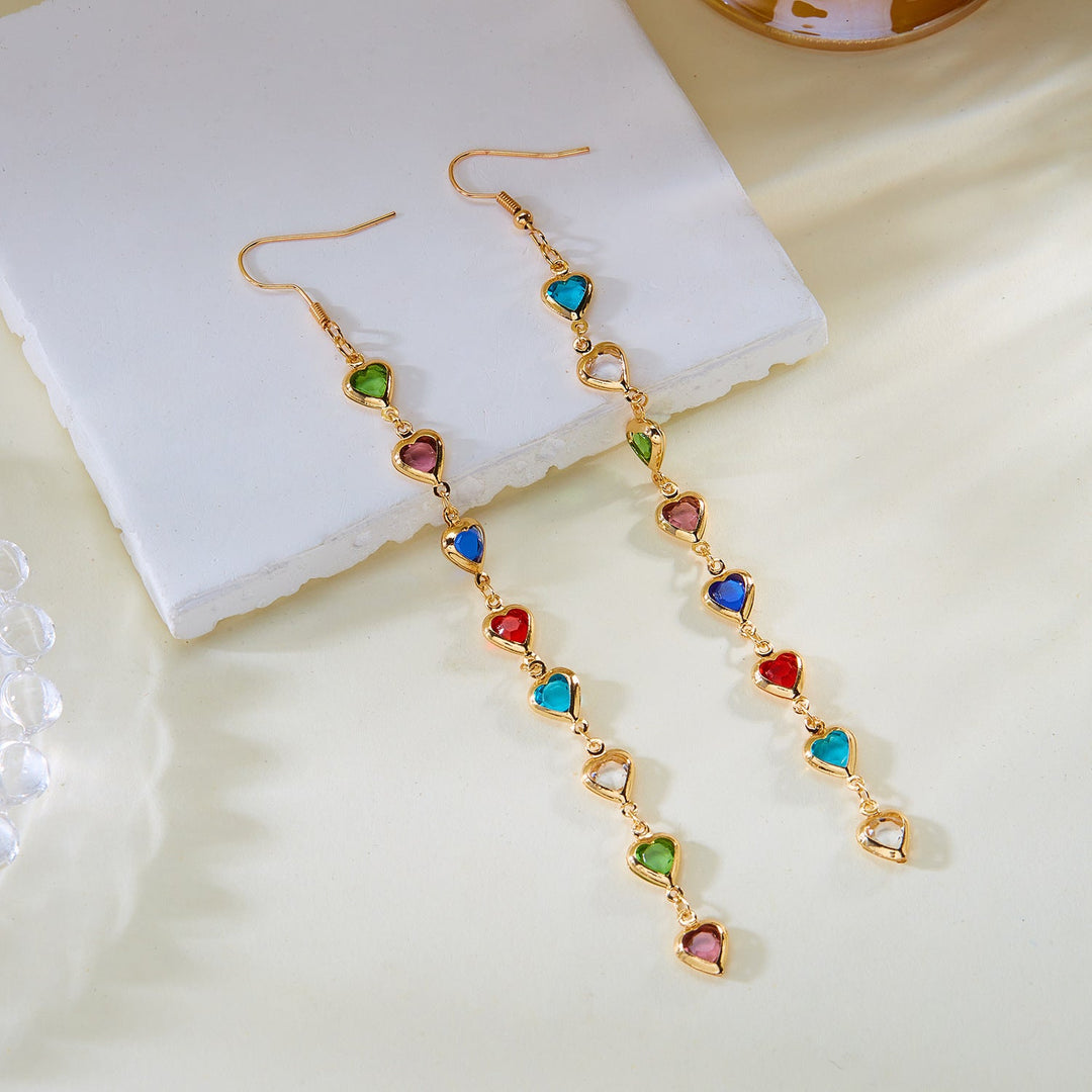 Elegant white heart-shaped dangling earrings. Dazzling fashion jewelry, a perfect statement gift for women.