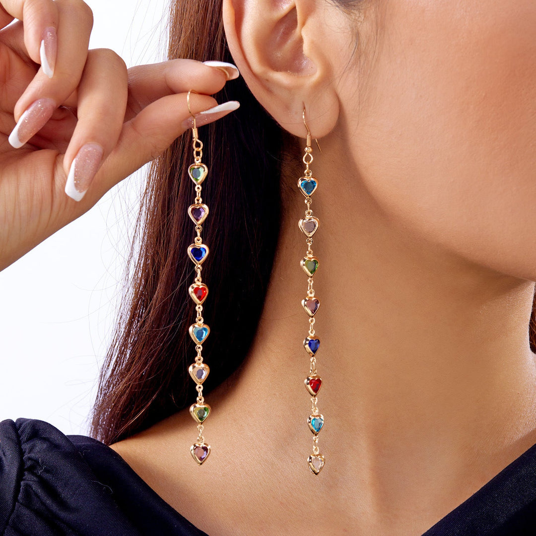 Women's white dazzling heart earrings. Elegant sparkling drop earrings, fashionable dangling jewelry.