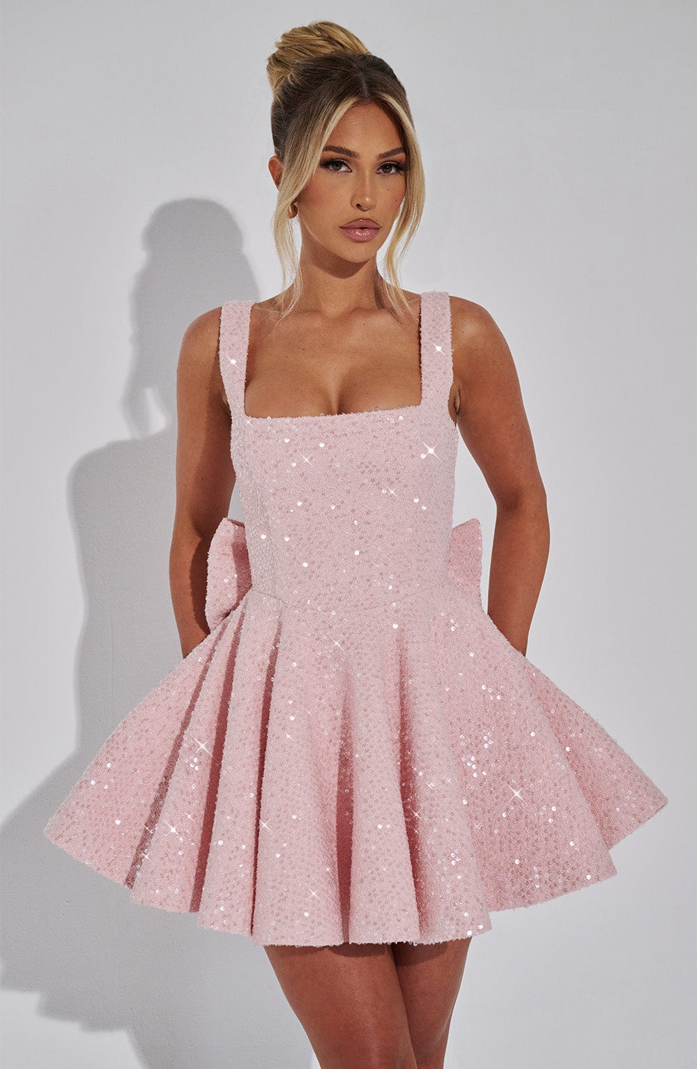 Dazzling pink sequin bow mini dress for women. Perfect sleeveless party & cocktail dress for special occasions.
