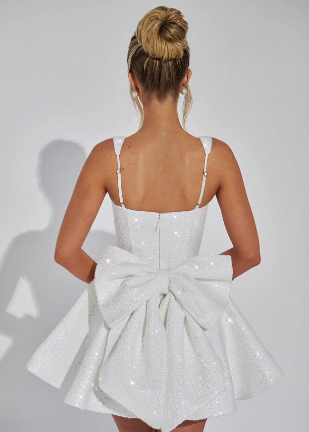 Glamorous sequin bow mini dress. Dazzling women's cocktail & party wear, ideal for special occasion fashion.