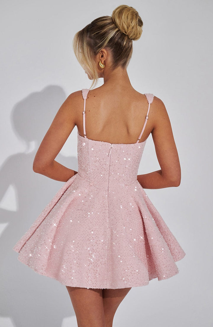 Front view of a dazzling sequin bow mini dress. Perfect sleeveless party dress for women's special occasions.