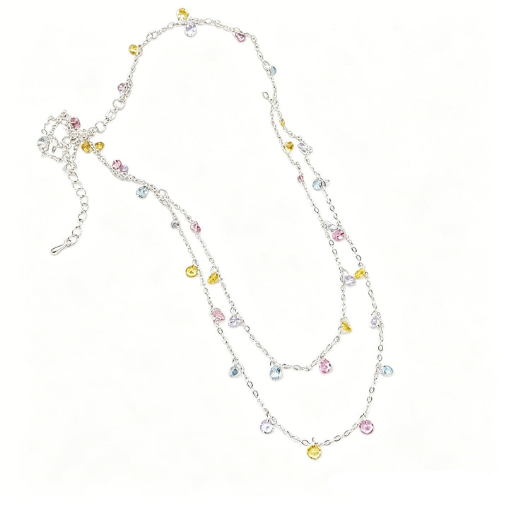Dazzling women's silver ankle bracelet with multiple charms, an elegant fashion accessory.