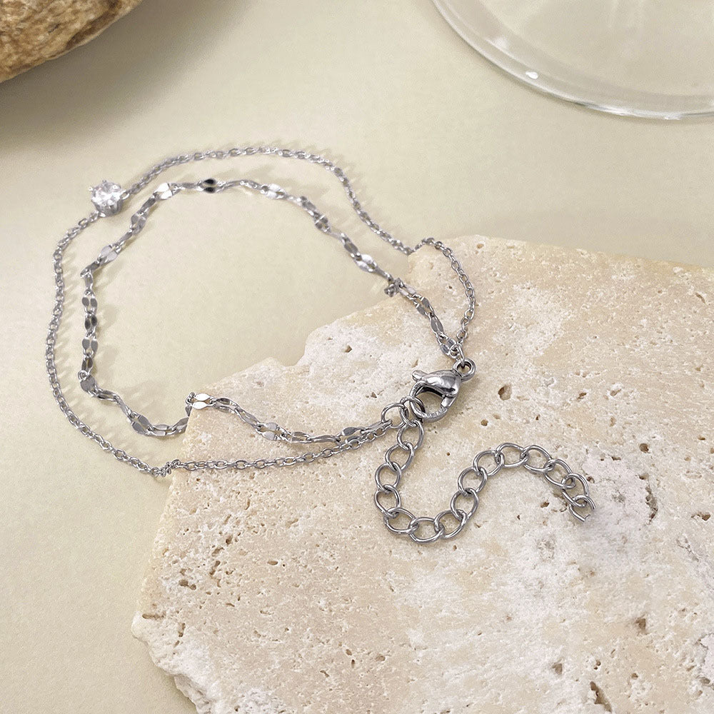 Elegant gold double strand anklet for women, adjustable delicate foot chain, summer beach accessory.