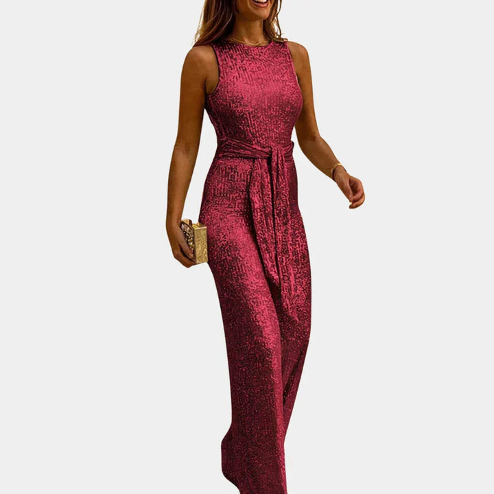 Women's dazzling glitter jumpsuit. Elegant sleeveless V-neck, perfect for glamorous party & evening wear.