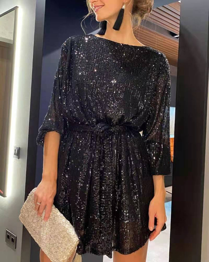 Sparkling women's sequin mini dress for parties. Elegant evening wear, a chic cocktail or formal dress for special occasions.