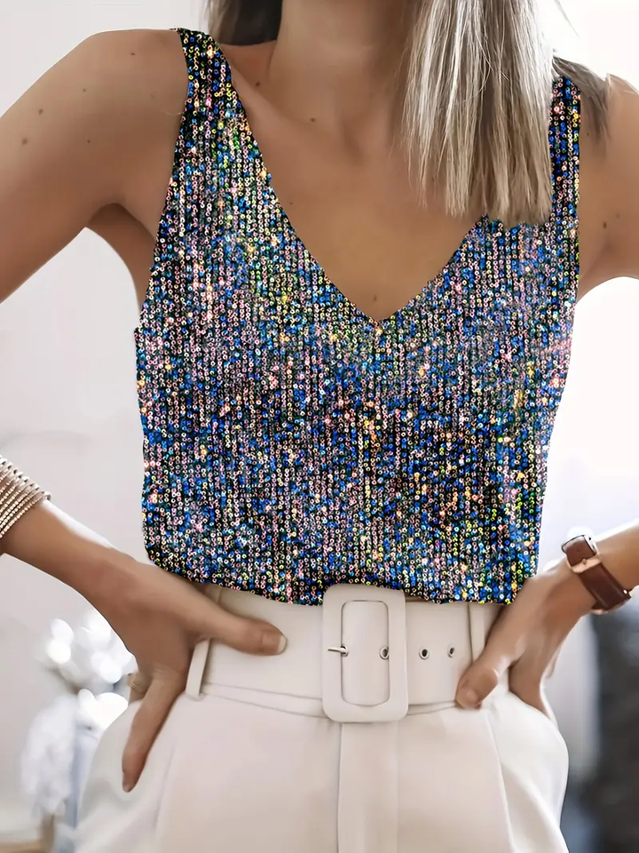 Close-up of a women's sequin sleeveless party top, showcasing dazzling shimmer & glamour.