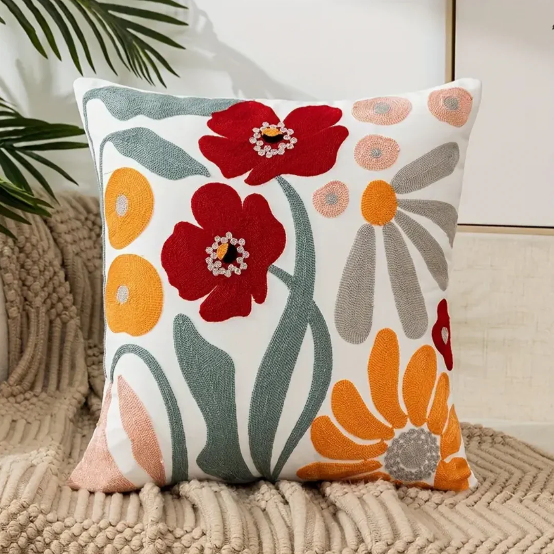 Decorative floral accent cushion for living room sofa. Soft throw pillow with a washable, removable cover for easy care.