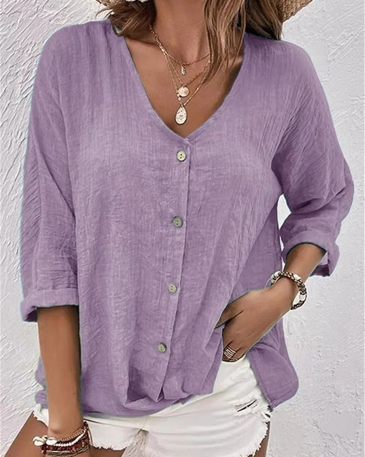 Deep V-neck button-down blouse for women, features stylish rolled sleeves, perfect for chic casual wear.
