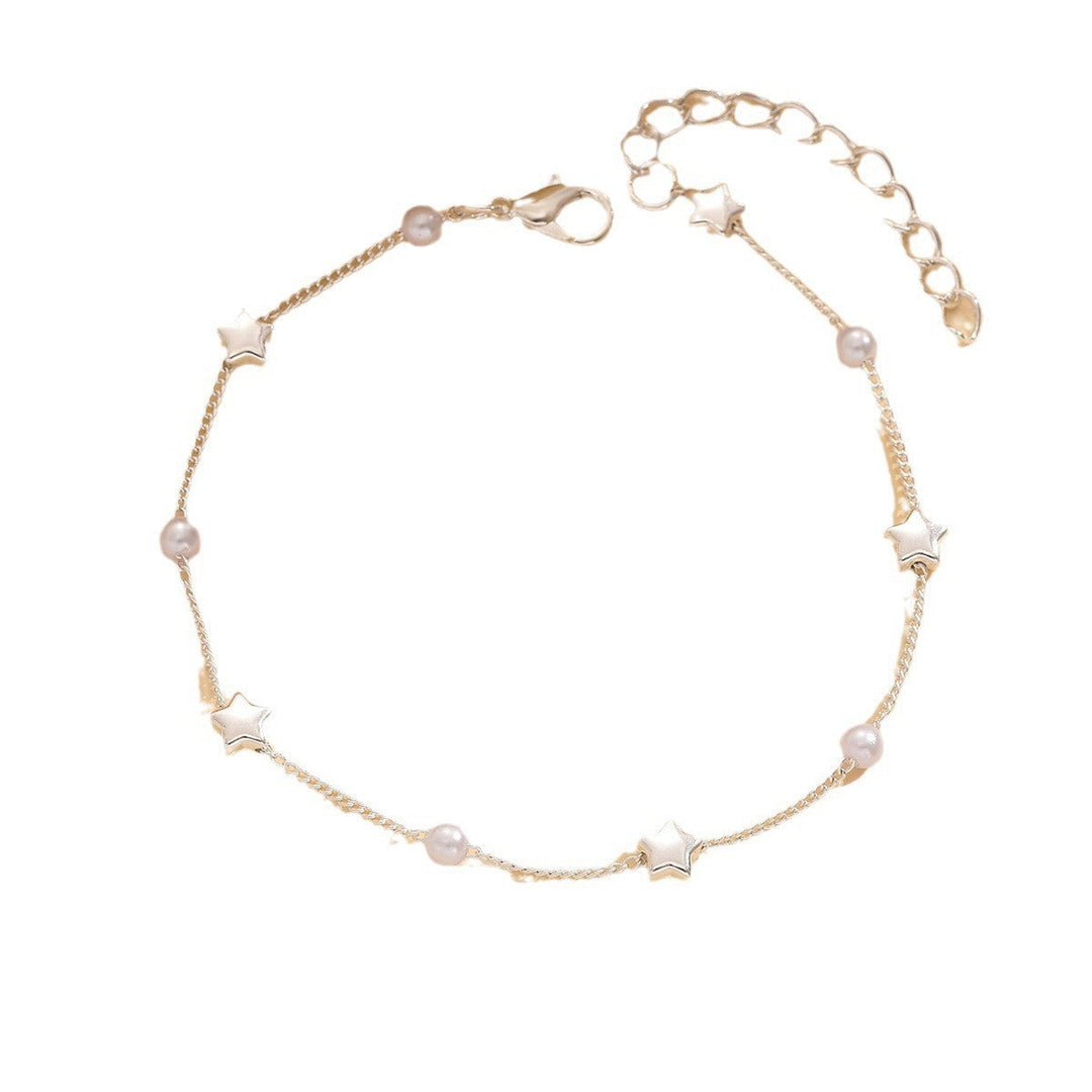 Trendy women's delicate star and pearl anklet, an adjustable gold-tone foot chain for summer style.