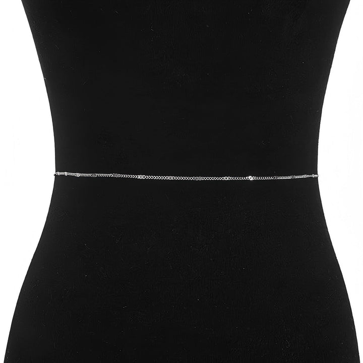 Versatile delicate metal chain belt, adjustable for women, adds a chic touch to dresses and tunics.