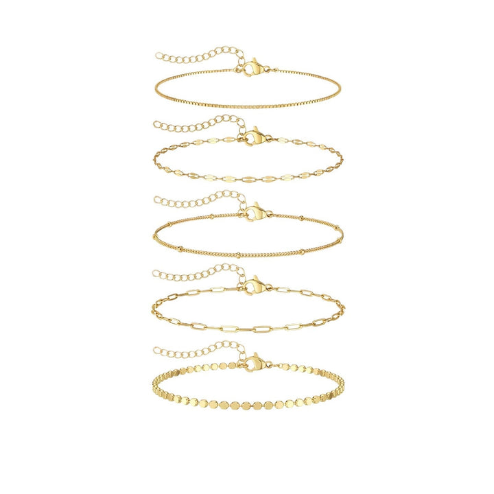 Stackable delicate gold chain bracelet set. Women's elegant fashion accessory, perfect for layering.