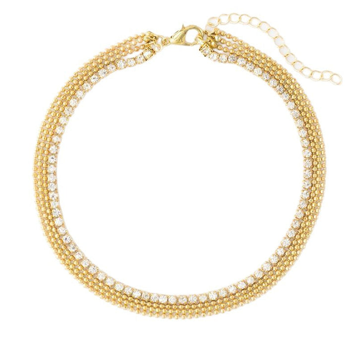 Stylish women's multi-chain layered anklet worn on ankle, a delicate summer fashion accessory for beach or casual.