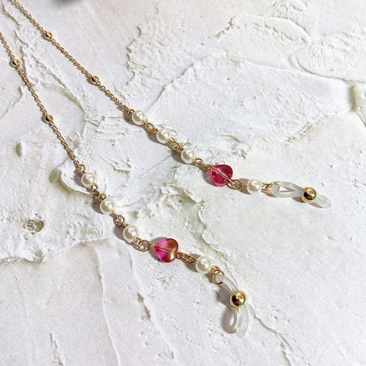 Delicate women's pearl & crystal filigree necklace chain, an elegant fashion accessory.
