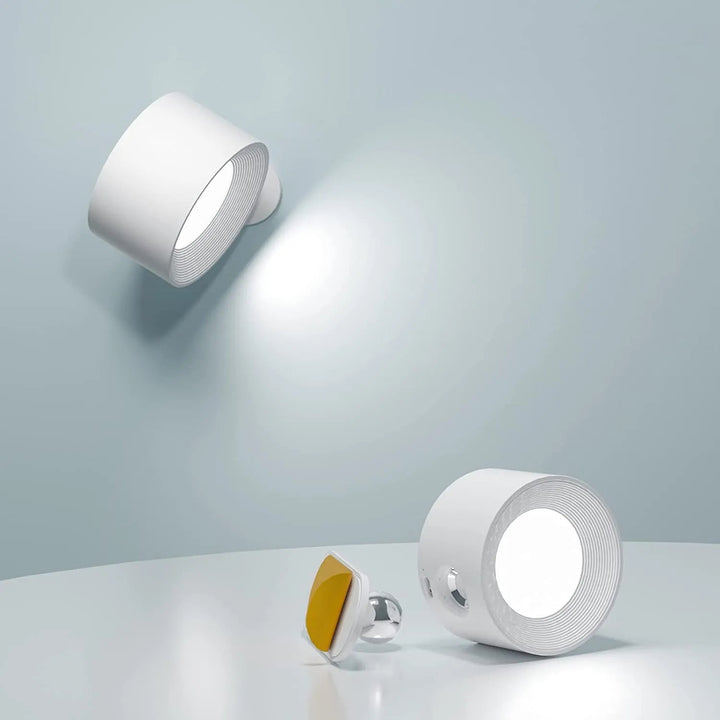 Dimmable, rechargeable, rotatable wireless wall light. Modern magnetic design for flexible home accent or task lighting.