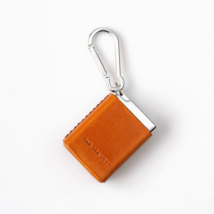 Discreet portable ashtray with secure, odor-proof lid, perfect for travel & outdoor use. Durable pocket ash container.