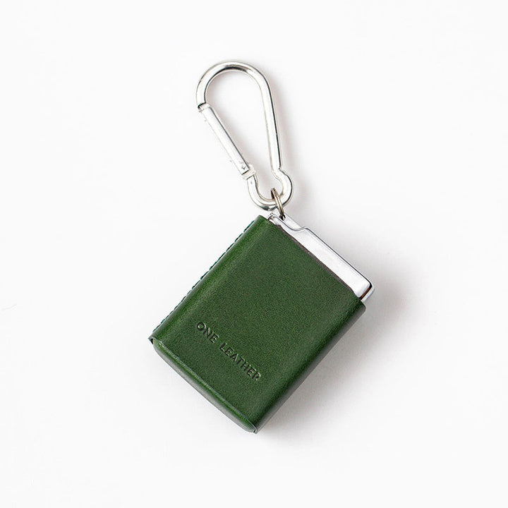 Pocket-sized outdoor ashtray with secure, odor-proof lid. Discreet ash container for travel, ensuring a clean environment.