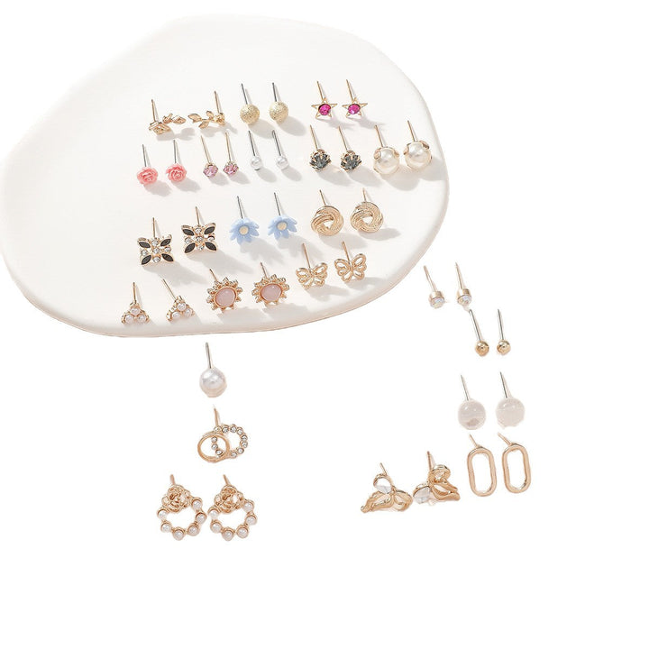 Trendy women's jewelry set with various earring styles: hoops, studs, and dangle designs for all occasions.