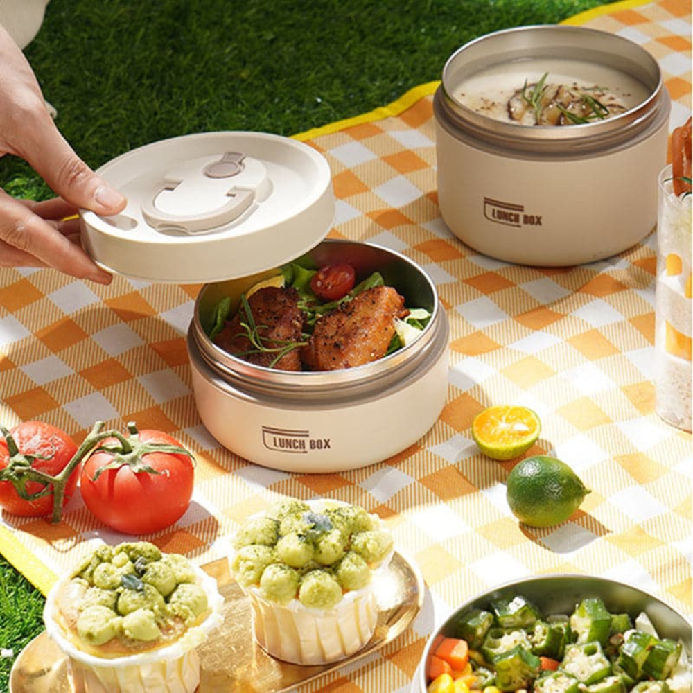 Stainless steel thermal food container, keeps meals hot or cold, perfect for work lunch.