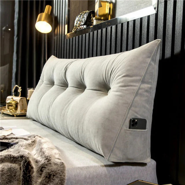 Plush DreamSlope headboard pillow providing ergonomic back and lumbar support for comfortable reading in bed.