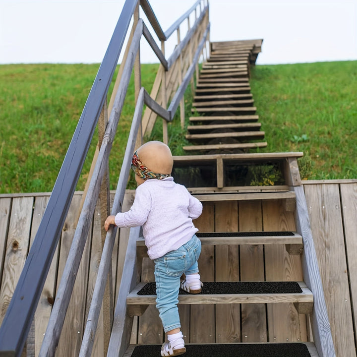 Textured rubber anti-slip safety strips for stair steps, providing secure extra grip & reducing fall risks.