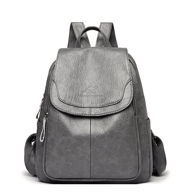 Classic women's leather backpack with adjustable straps & spacious interior, a chic fashion accessory.