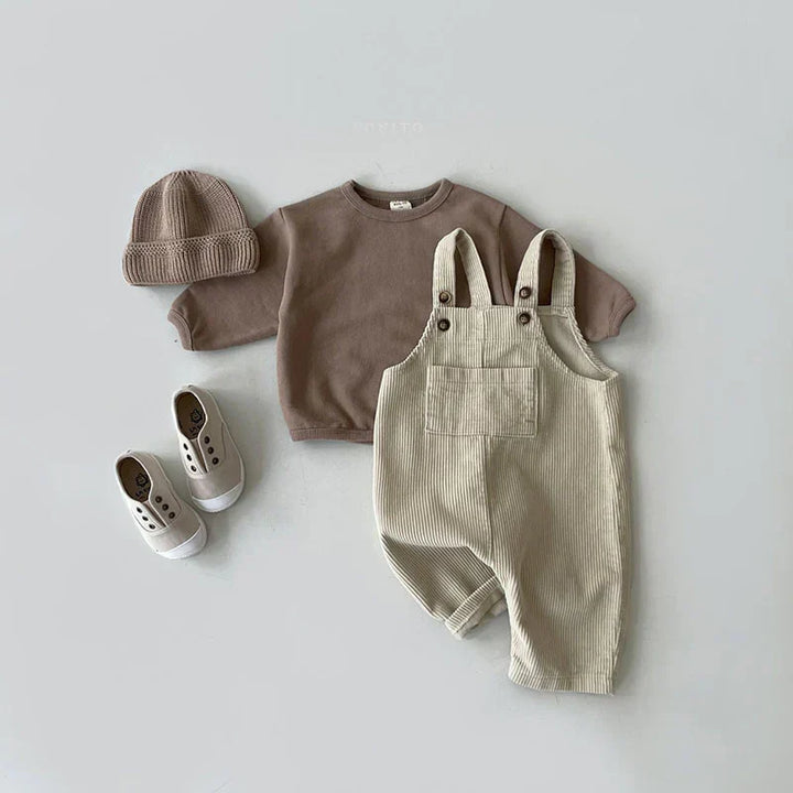 Play-ready corduroy overalls for children, a perfect fall or spring outfit for playgrounds.