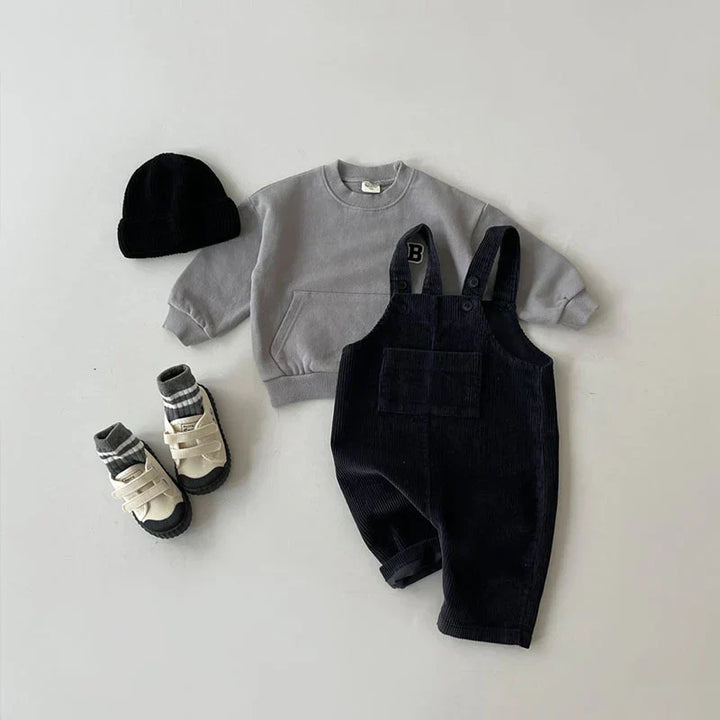 Soft, durable corduroy overalls for kids, ensuring comfort and style for active play.
