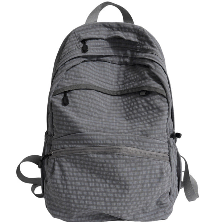 Spacious black multi-purpose school backpack, weather-resistant & stylish for travel, college, work, or daily use.