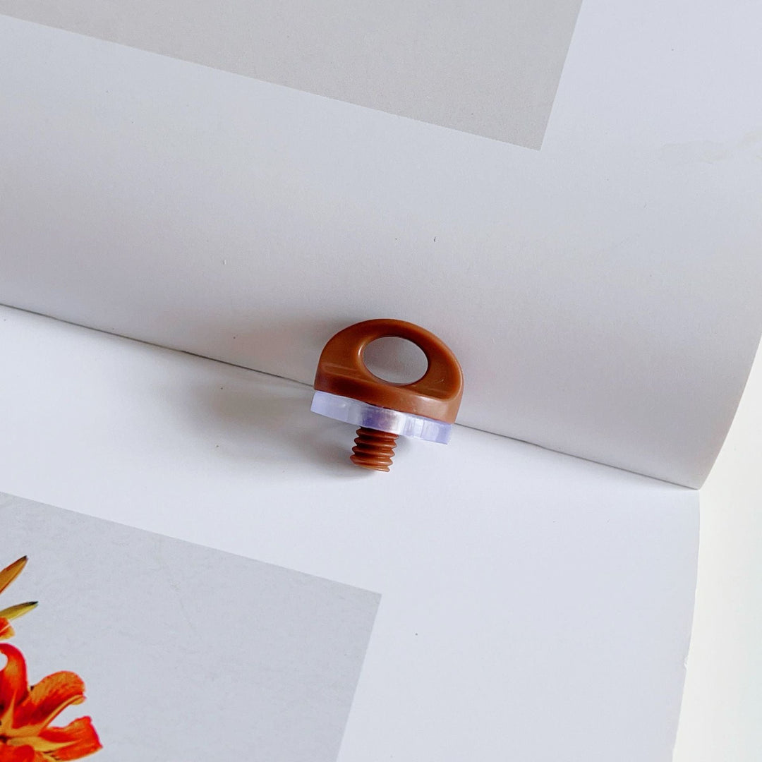 Sleek bookbinding component, an essential artsupply for elegant bookmaking and professional craft projects.