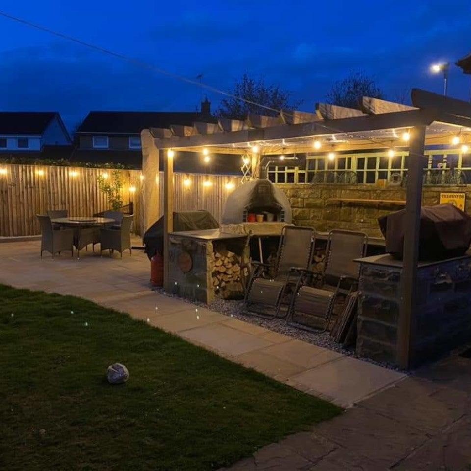 Decorative LED string lights, waterproof, create a warm glow for any outdoor living space or event.
