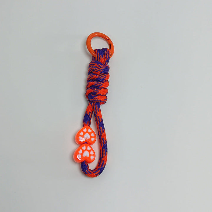 Multi-functional paracord keychain, a compact survival accessory for all outdoor activities.
