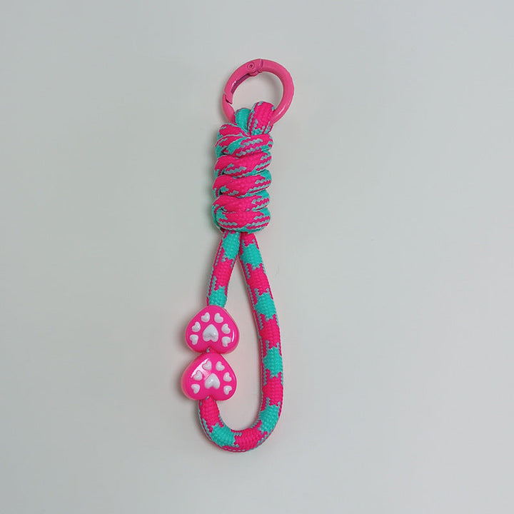 Adventure-ready paracord keychain; multi-purpose survival tool for any outdoor challenge.