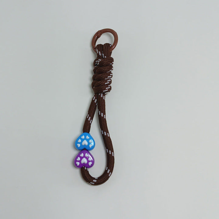 Practical multi-use paracord keychain, essential for outdoor enthusiasts & daily security.