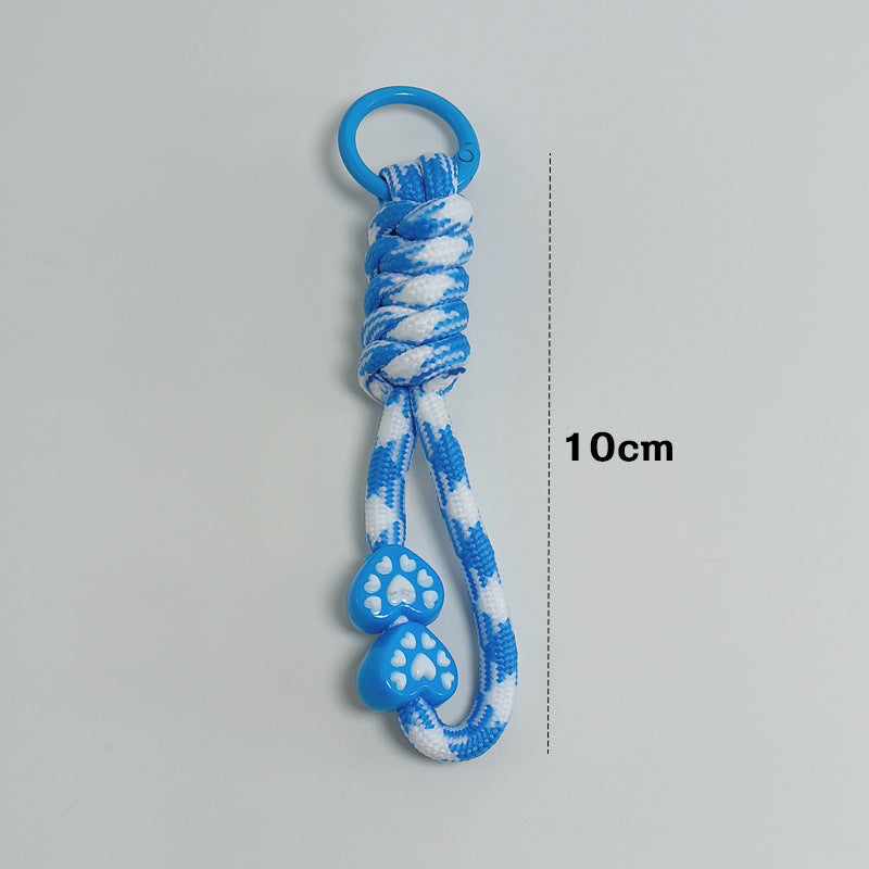 Paracord key holder with survival features, ideal for camping, hiking, & outdoor emergencies.