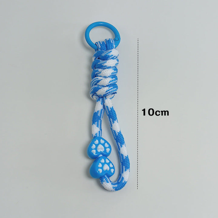 Paracord key holder with survival features, ideal for camping, hiking, & outdoor emergencies.