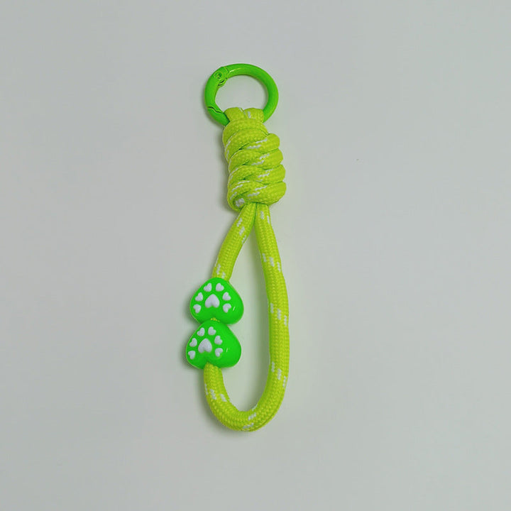 Adventure gear: durable paracord keychain, a versatile multi-use tool for explorers.