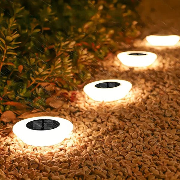 Rust-proof solar pathway lights illuminate gardens & landscapes, perfect for durable outdoor exterior decor.